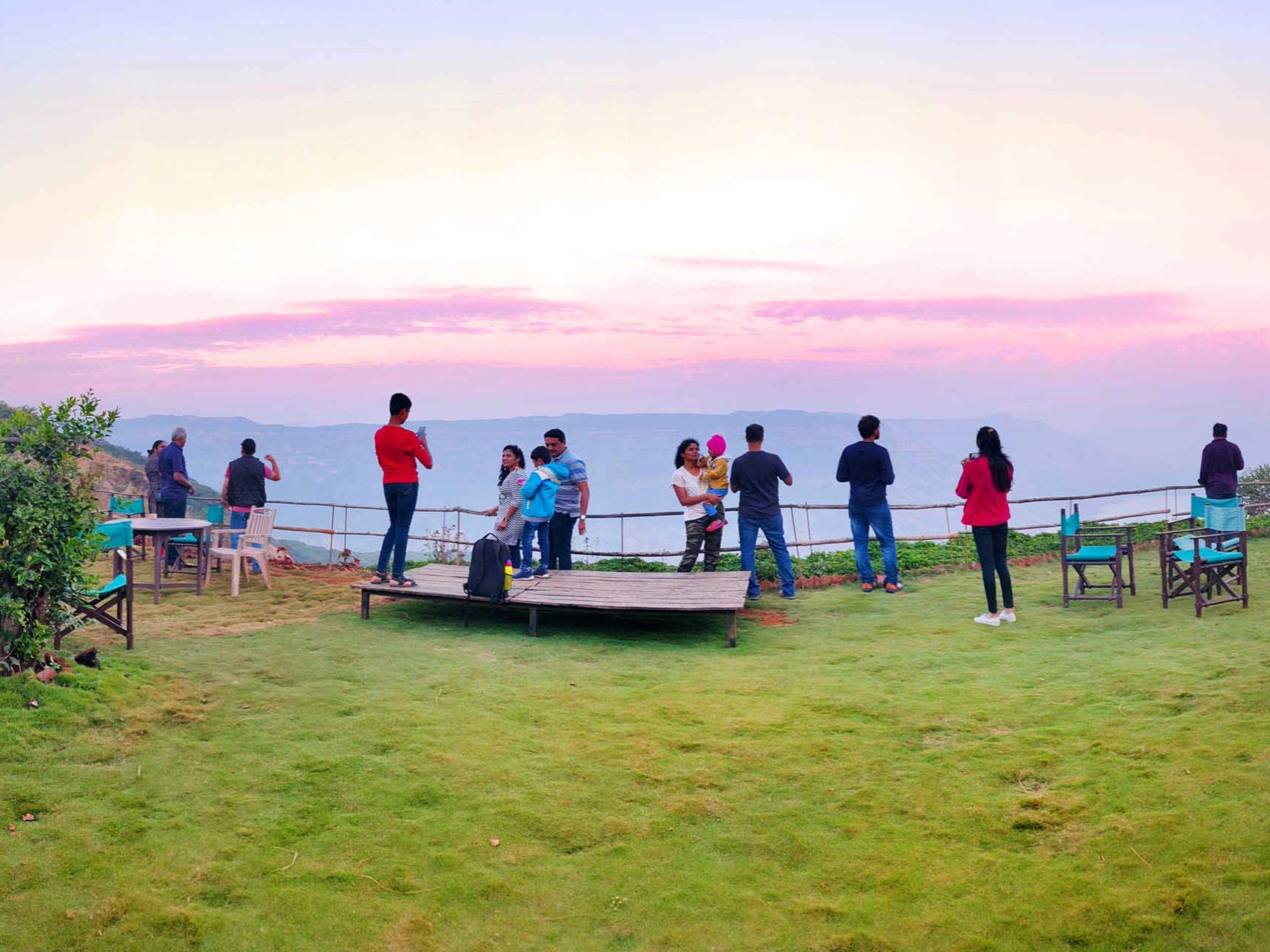 Guests taking a peaceful valley walk, enjoying scenic views at Ramsukh Resort.